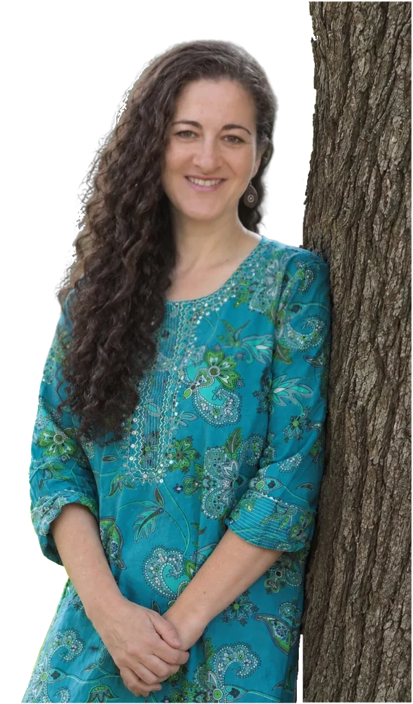 Devorah leaning against a tree